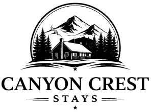 Logo for Canyon Crest Stays featuring a black and white illustration of a cabin in front of pine trees and mountains.